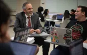 Professor sitting with student