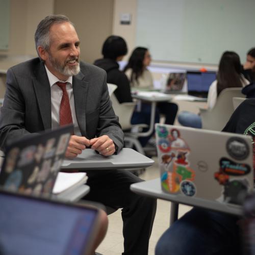 Professor sitting with student